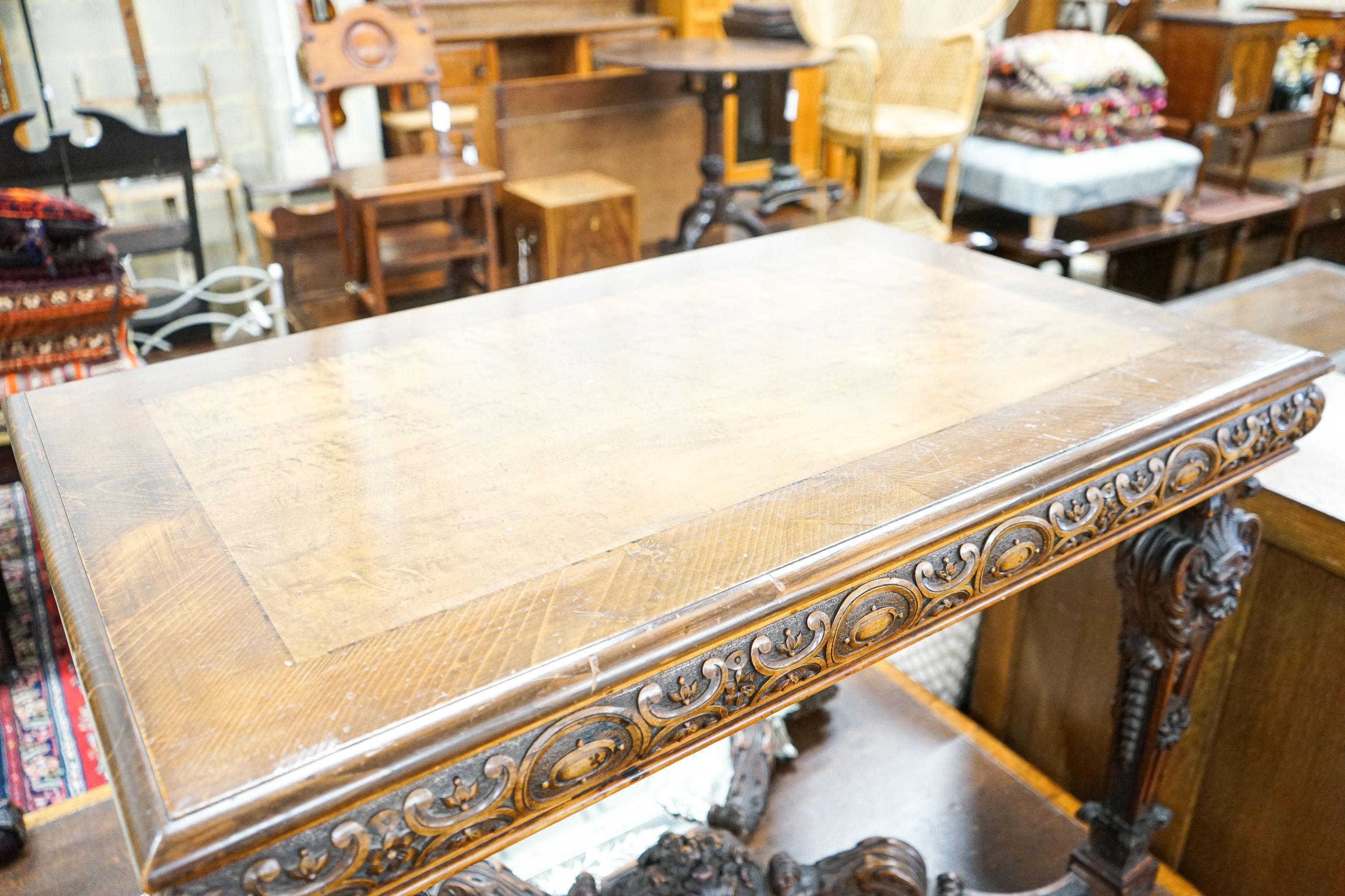 A Flemish carved walnut and beech centre table, width 100cm, depth 63cm, height 77cm